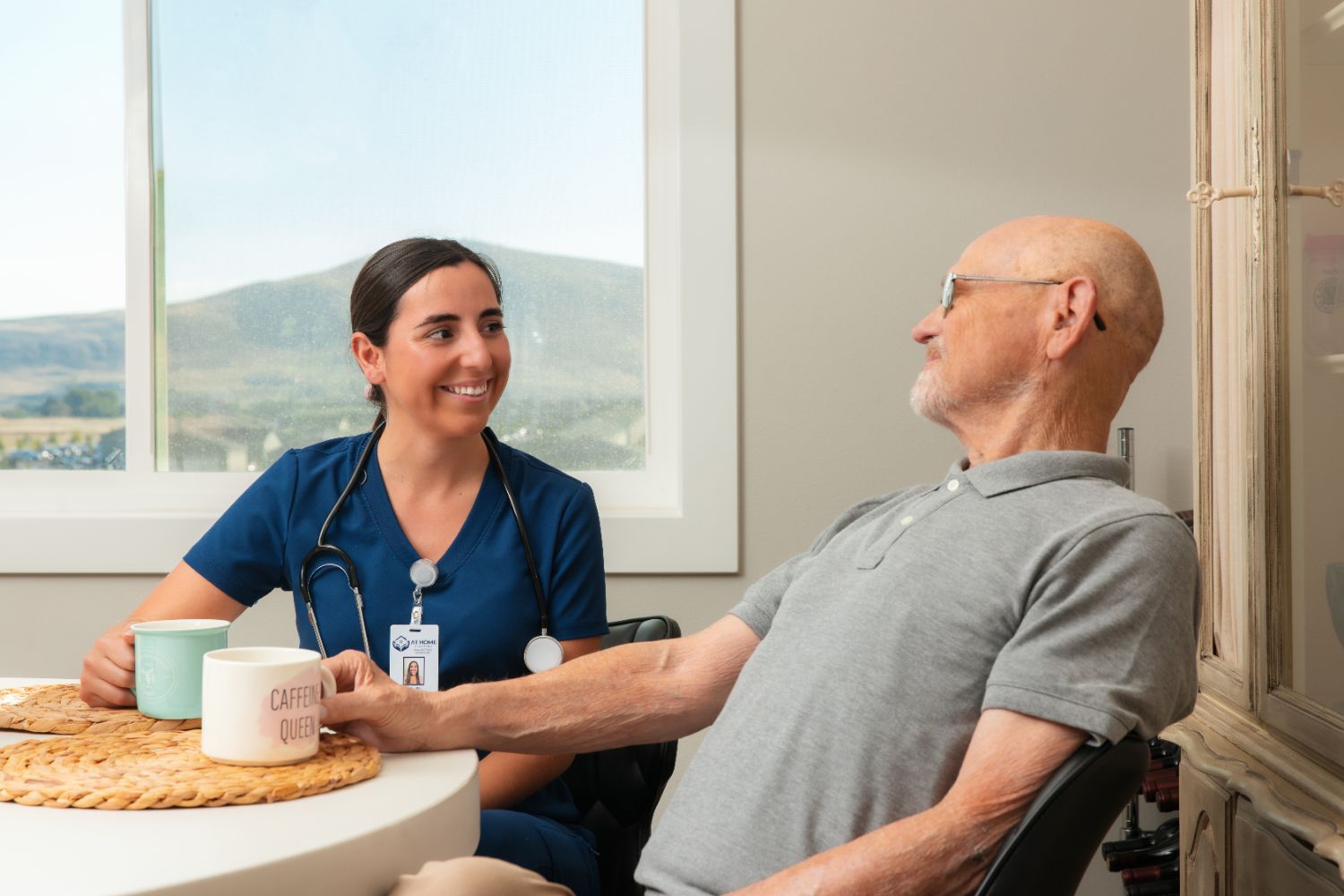 A caregiver visits with a client at home