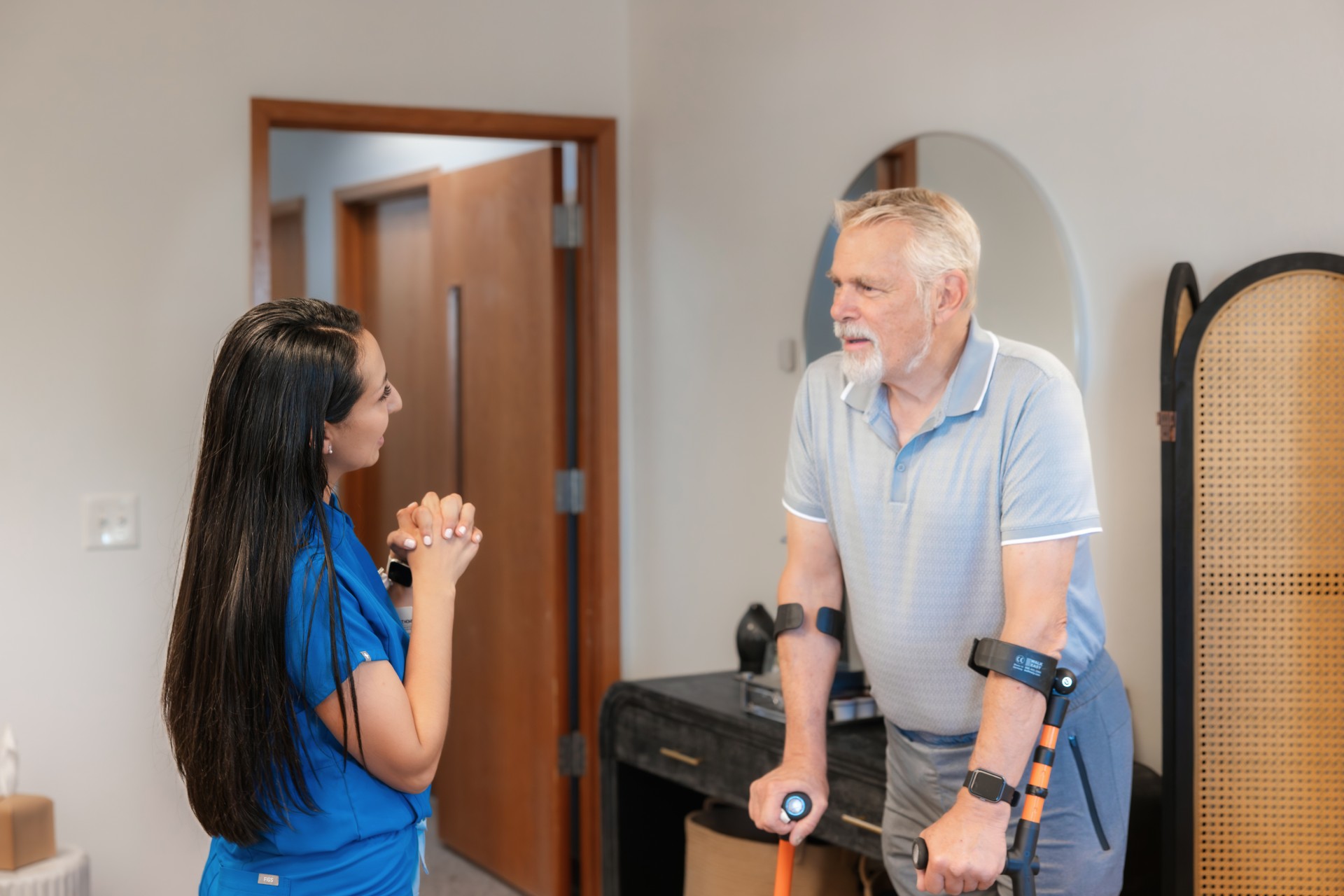 A home care aide talking to client